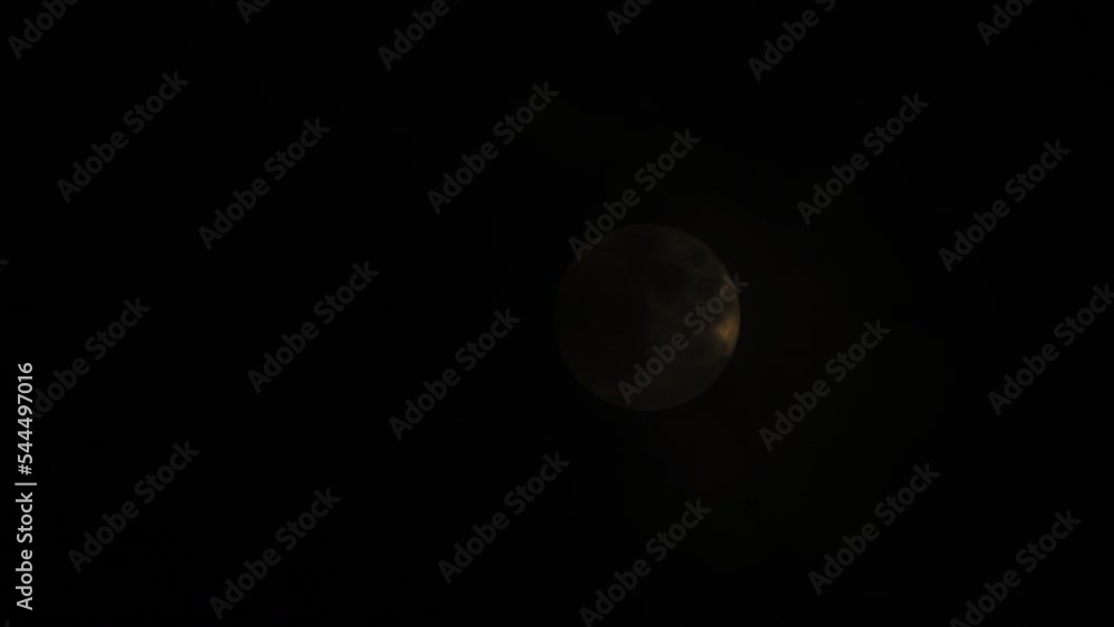 Glowing full Moon dark sky with moving clouds Glowing full Moon dark sky with moving clouds