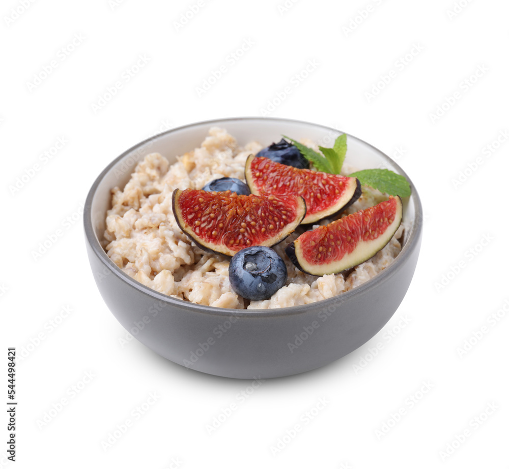 Bowl of oatmeal with blueberries, mint and fig pieces isolated on white Bowl of oatmeal with blueberries, mint and fig pieces isolated on white