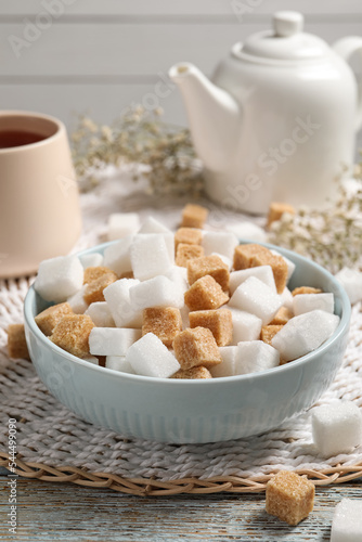 Photography Different refined sugar cubes in bowl on rustic table
