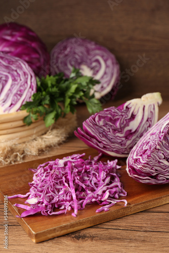 Cut fresh red cabbage on wooden table