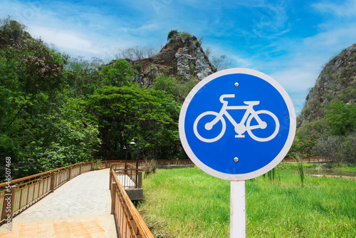 Bicycle traffic sign on nature walks and cycling path in natural park.