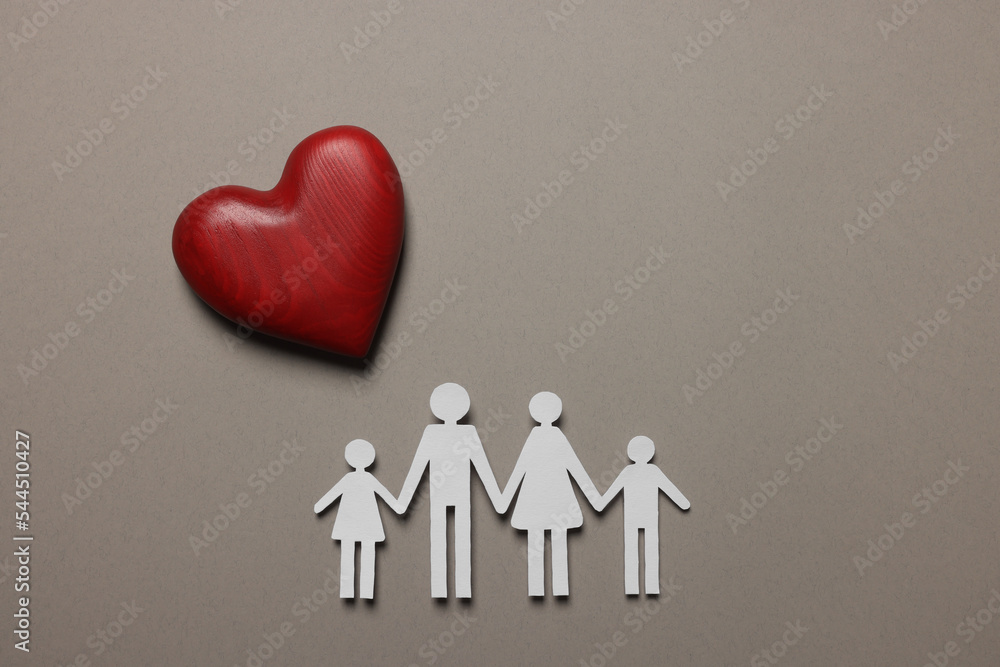 Paper family figures and red wooden heart on light grey background, flat lay. Insurance concept Paper family figures and red wooden heart on light grey background, flat lay. Insurance concept