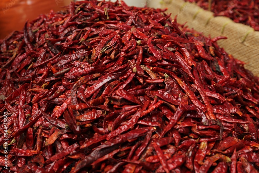 Fototapeta premium Pile of spicy dried red chili peppers at market