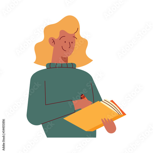 blond woman writing in book