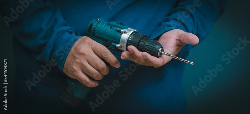 close-up hand holding an electric drill