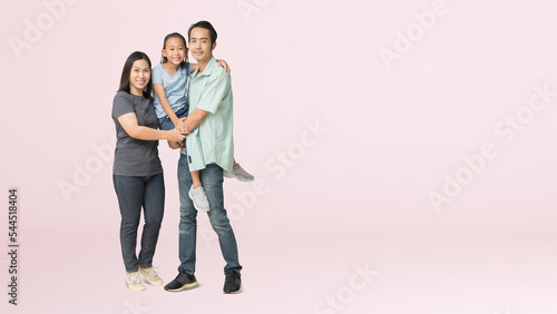 Happy asian family of father, mother and daughter hug, isolated on pink background with Clipping paths for design work empty free space