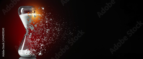 Canvas Print Disappearing hourglass on dark background with space for text