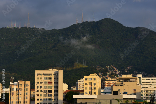 The district of Tijuca and a favela  of the Zona Norte, or North Zone, of Rio de Janeiro, Brazil, backed by the Atlantic rainforest of Tijuca National Park photo