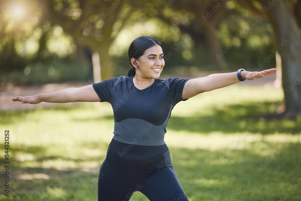 Stockfoto med beskrivningen Woman, music earphones and yoga in park, nature  environment or sustainability location for wellness, health or body  mobility. Smile, happy or stretching yogi listening to zen podcast or  mindset
