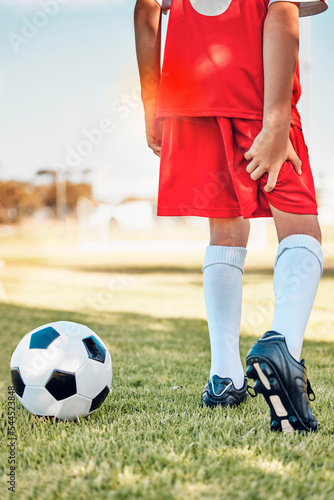 Fitness, soccer kid or hamstring pain on soccer field for workout exercise, training or football training match. Health, wellness or injured soccer player for muscle injury, leg or medical emergency