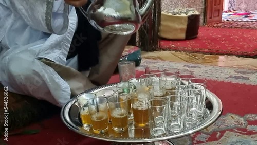 shot of a man serving tea in the city of Ayoun (Aaiun). City currently controlled by Morocco. photo