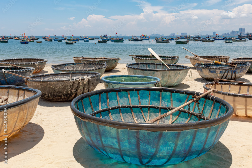 Blue basket boat on the sandy beach coastline in DaNang Vietnam