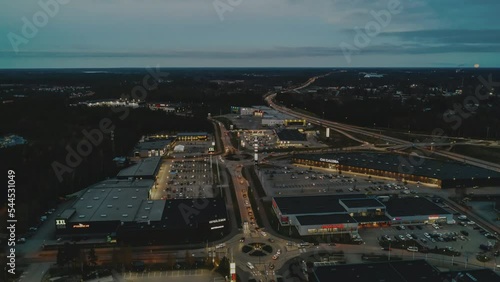 Aerial night hyperlapse, busy rush hour traffic on shopping street in Vaasa, Finland photo
