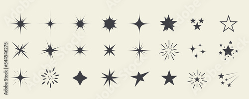 Sparks and stars. Set of black stars and sparkles isolated on white background. Sparkles symbols.