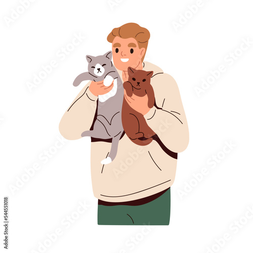 Happy cat owner holding two kittens in arms. Smiling man with adorable funny ...