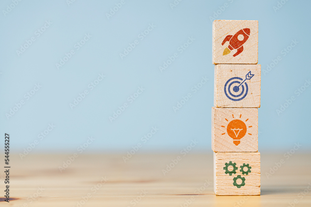 Wood cube block stacking with icons. Business strategy and action plan ...