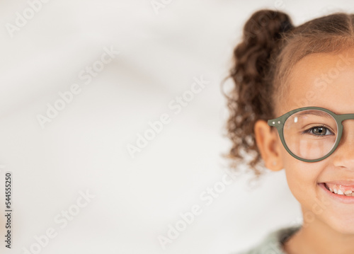 Mockup, advertising and girl with glasses from optometrist for vision in eyes at a clinic, store or shop. Half, happy and child with medical eyeglasses from optician with mock up space for marketing