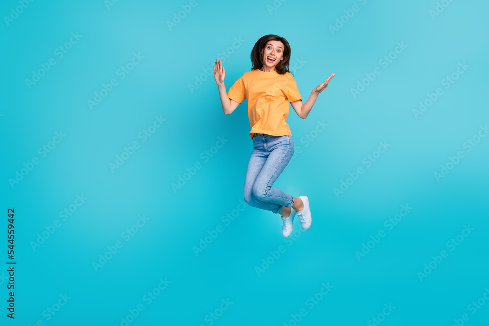 Full length photo of adorable lady wear comfort clothes good mood weekend holiday empty space isolated on blue color background Full length photo of adorable lady wear comfort clothes good mood weekend holiday empty space isolated on blue color background