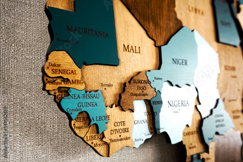 West Africa, Mali, Senegal, Guinea, Cote d\'ivoire, Ghana, Liberia, Benin on wooden world map. Political color interior map of the world with countries on the wall.