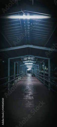 Fototapeta Naklejka Na Ścianę i Meble -  light in the tunnel. Railway station bridge. Railway Station corridor 