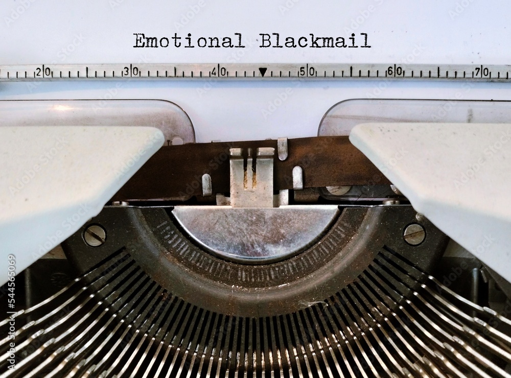 Vintage typewriter with typed text Emotional Blackmail, refers to