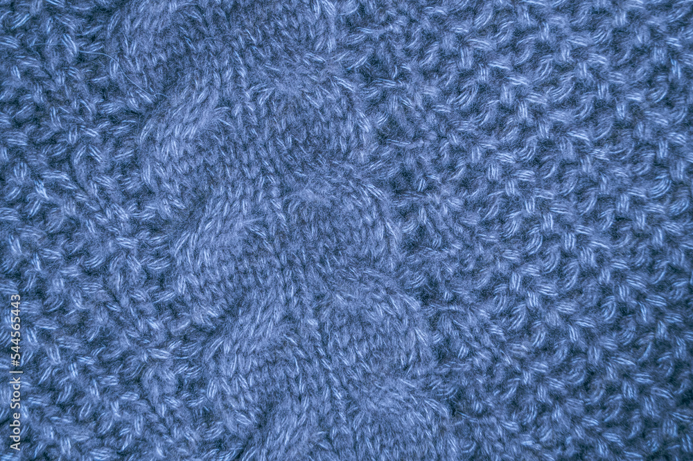Organic knitting material with macro weave threads.