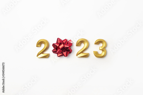 2023 Golden Numbers on White Table. Modern New Year Background. Creative Greeting Card. Flat Lay, Top View, Copy Space. Banner Design. Minimal Festive Mock Up with Numbers. Time to Celebrate Holiday