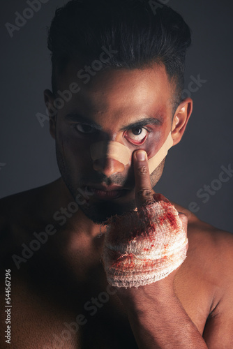 Vászonkép Blood, boxing injury and man with bruise from fight conflict, criminal violence or dark crime with middle finger emoji sign