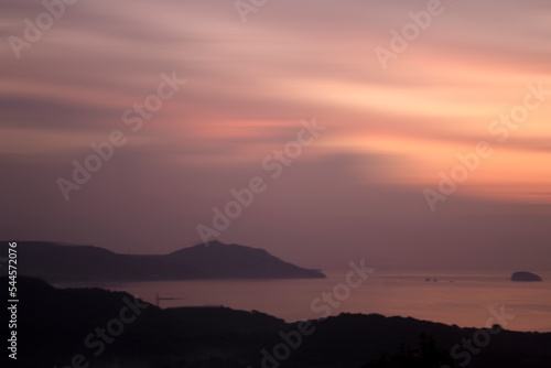 Light brown yellow and orange sunrise sky colors background. Sunset over the sea and mountains. Nature landscape backgrounds. Copy space. Inspirational backgrounds.
