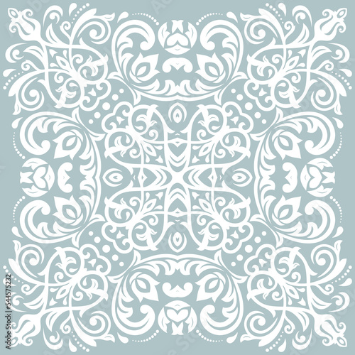 Oriental light blue and white pattern with arabesques and floral elements. Traditional classic ornament. Vintage pattern with arabesques