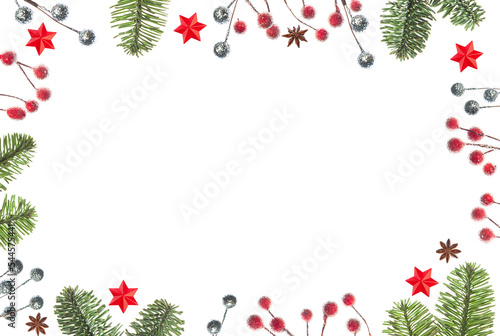 Christmas decoration. Frame of branch christmas tree, ball, stars, red berry on a white background with space for text. Top view, flat lay