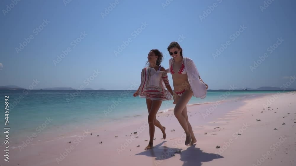 Two girlfriends climbed up the abandoned beach watchtower and enjoyed the beautiful sea view from there Two girlfriends climbed up the abandoned beach watchtower and enjoyed the beautiful sea view from there