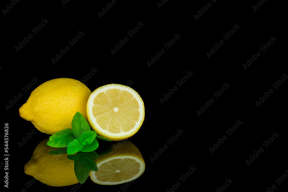 Still life, lemon and lime on black background