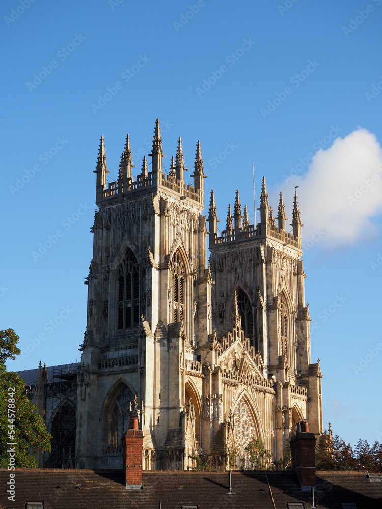 Fototapeta premium The historic Minster at York seen above the roofs of some terraced housing