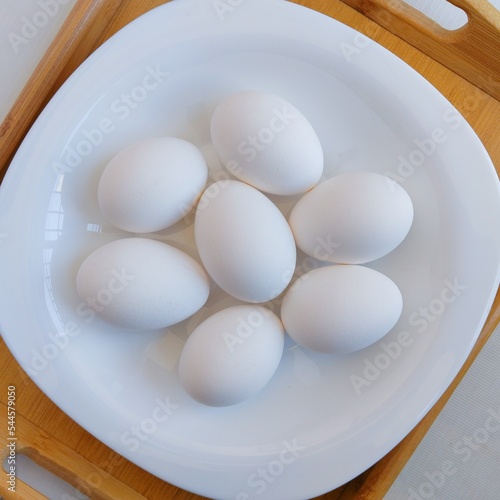 Eggs chicken egg hen-eggs poultry white layer hen eggs fowl eggs anda oeuf ei uovo heuvo raw food in a plate closeup view image stock photo photo