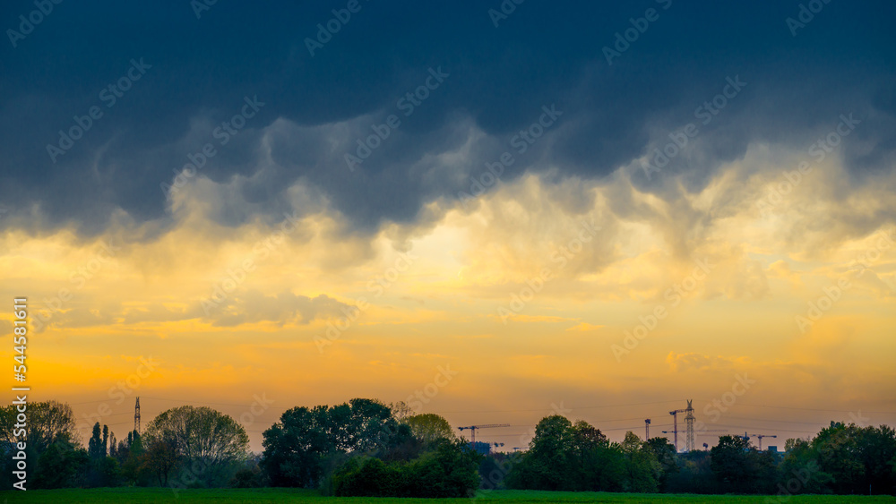 Fototapeta premium Ominous dark thunderclouds over landscape