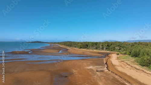 Aerial across quintessential golden Queensland beach on sunny winter day photo