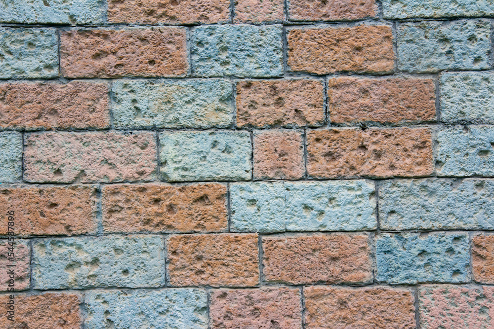 Fototapeta premium Texture stone wall , briquette color and light blue , stone look background.