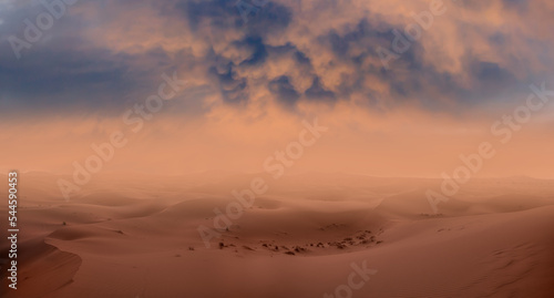 Foto Sand dunes and sand storm in the Sahara desert - hot and dry desert landscape