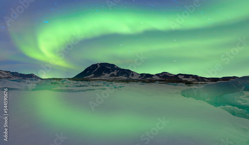 Iceberg floating in greenland fjord with aurora borealis