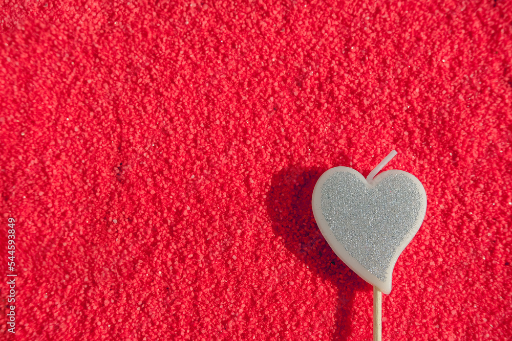 silver heart candle on red textured background, greeting valentine holiday card silver heart candle on red textured background, greeting valentine holiday card