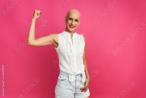 portrait of a woman suffering from breast cancer, with an optimistic gesture of strength and hope
