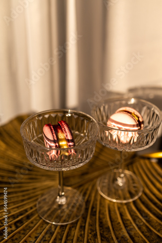 Macaroni cakes in glasses. At sunset