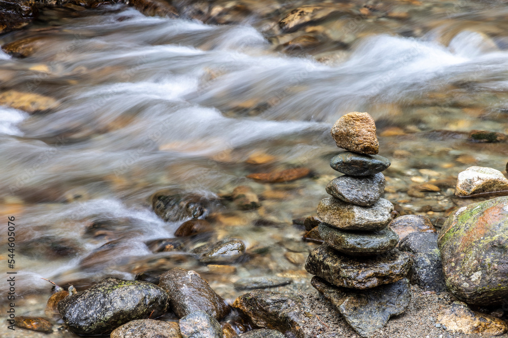 Mountain stream and stone tower
