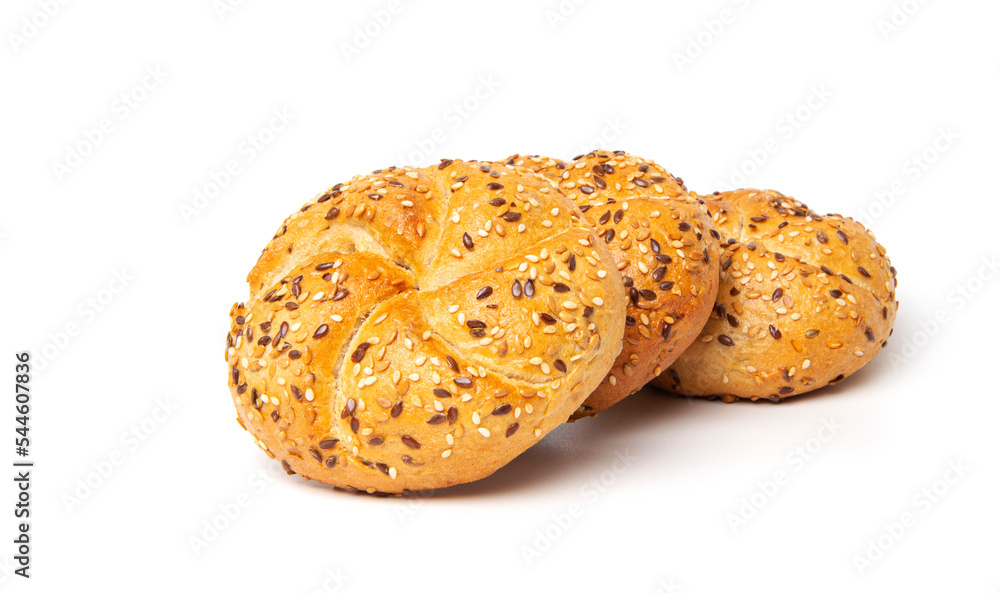 Traditional white kaiser roll with linseeds and sesame seeds isolated on white background
