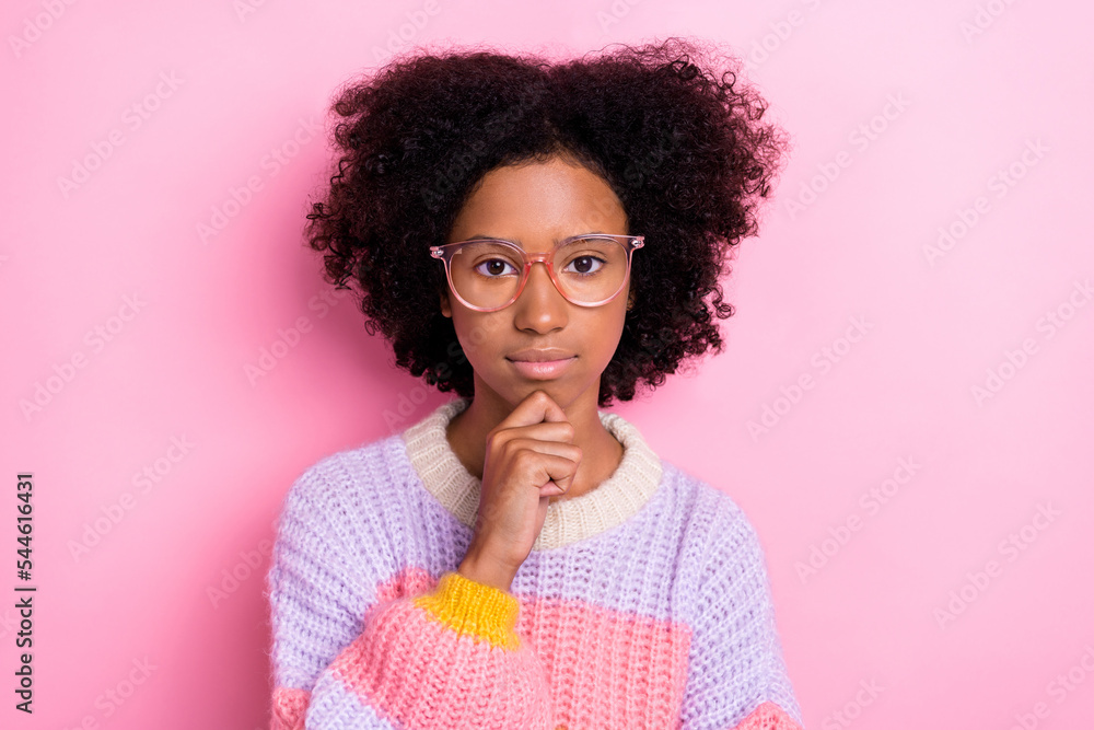 Portrait photo of beautiful chevelure teenager girl touch chin thinking about her future looking you serious face isolated on pink color background Portrait photo of beautiful chevelure teenager girl touch chin thinking about her future looking you serious face isolated on pink color background
