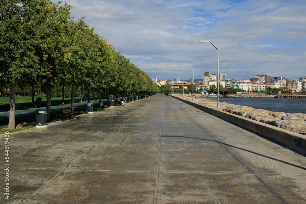 Sea coast, promenade for walks and stones, breakwaters and ships. On the streets in Istanbul, public places. Sea coast, promenade for walks and stones, breakwaters and ships. On the streets in Istanbul, public places.