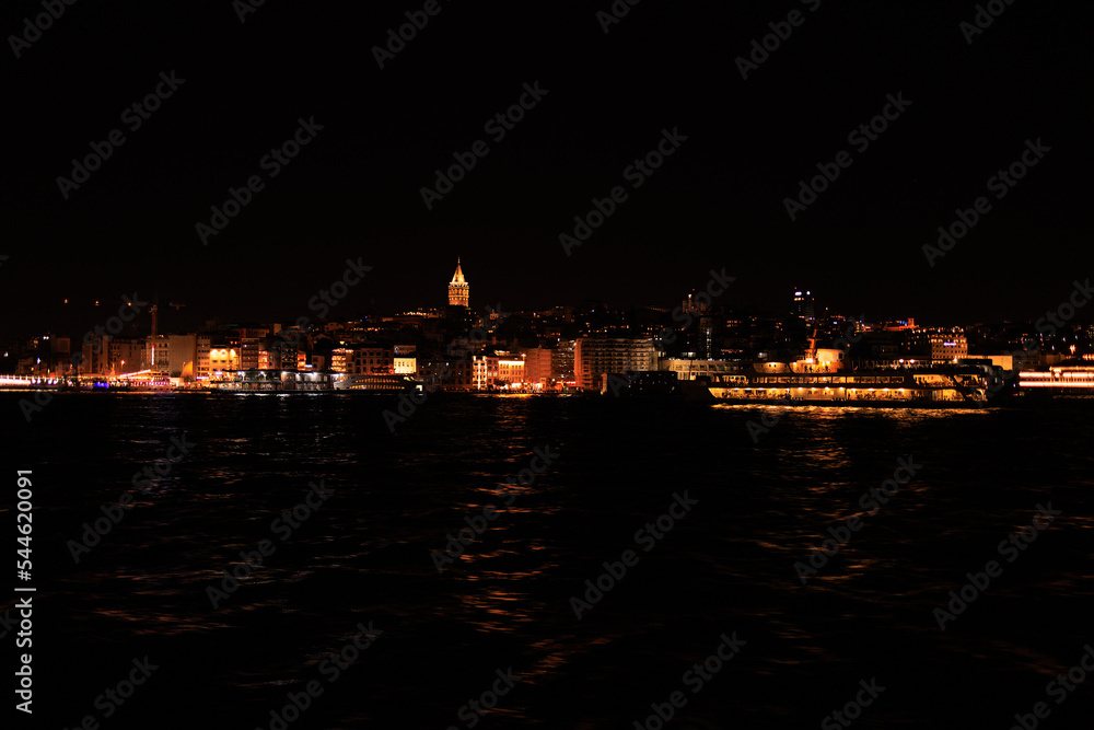 Night sky and light over the sea. Silhouette of the city of Istanbul. Night sky and light over the sea. Silhouette of the city of Istanbul.