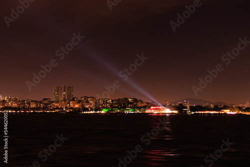Night sky and light over the sea. Silhouette of the city of Istanbul.