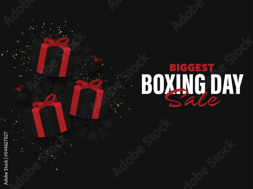 Biggest Boxing Day Sale Poster Design With Realistic Gift Boxes, Snowflakes, Baubles And Glitter Effect On Black Background.